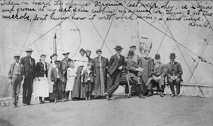 Passengers pose on the bow of the Virginia, 
	click for larger image