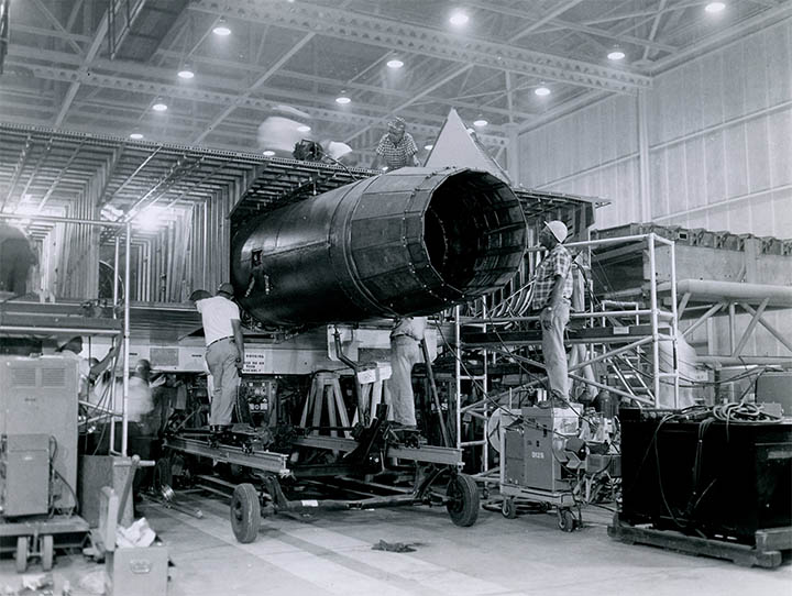Technicians installing the YJ93 into AV-1 at Palmdale, click for larger image